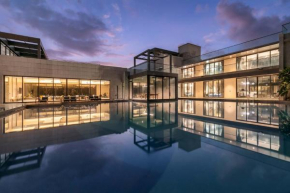 Colossus by StayVista - Riverside luxury villa in Khalapur with a Spacious pool, Sauna, Private theater, Gazebo & Lawn